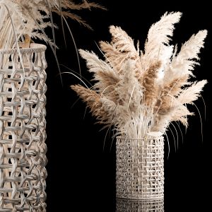 Bouquet Of Dry Reeds In A White Wicker Basket