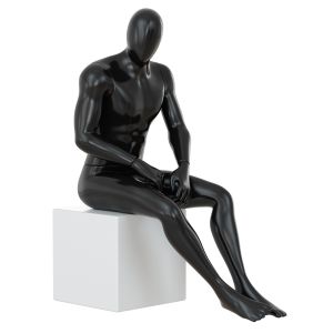 Black Mannequin Sitting On A White Stool 68